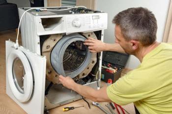 washing machine repair technician fixing front load washer in Abilene TX
